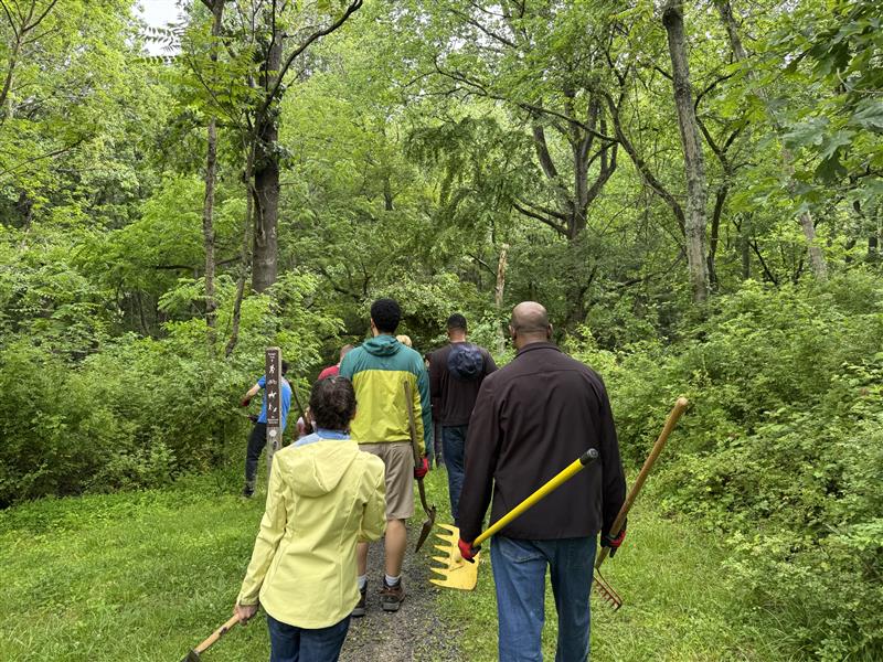 OESRM Public Service Event - The Maryland Transportation Authority's Office of Environment, Safety, and Risk Management partnered with Montgomery County Parks for a public service event. Photo shows volunteers restoring and enhancing a portion of the Kengla Trail in Rock Creek Regional Park.